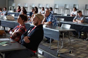 group of students listening to a new student orientation presentation