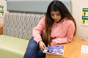 person reading college transfer flyer