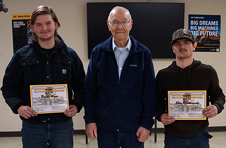 Two students and Jim DeBord pose for a photo.